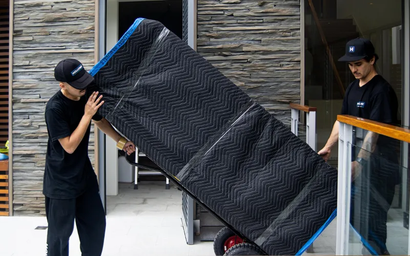 Moving a Protected Sofa onto a Dolly